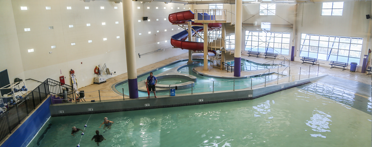 Lifeguard watching over a group swimming in a pool